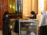 Huanuco - cute nons selling cookies in front of church