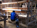 A weaver at work - check out the size of that ¨machine¨ and his beautiful little daughter