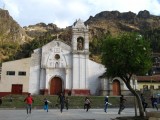 Huancavelica - 16th century church & adolescents practicing their traditional dance performance