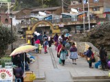Huancavelica - cute little bridge filled with traditionally clothed ladies selling their goods