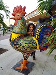 Hafsah posing with a Havanese chicken