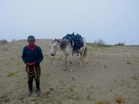 Q loop man met paard