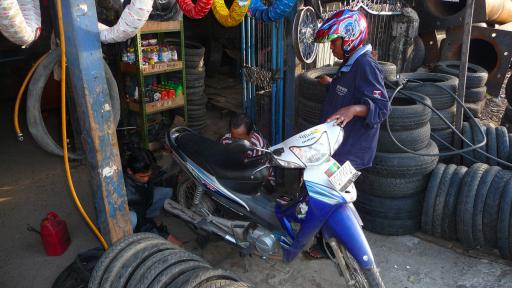 577 Makassar, On my way to the Airport fixing the rear tire
