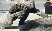 Man in brons onderdeel van de geldstroom