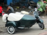Vespa met zijspan