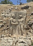 Koning Antiochus schudt Herakles de hand