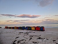 Muizenberg beach bij zonsondergang