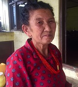 Old woman serving tea