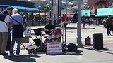 Straat muziekant bij Fishermans Warf