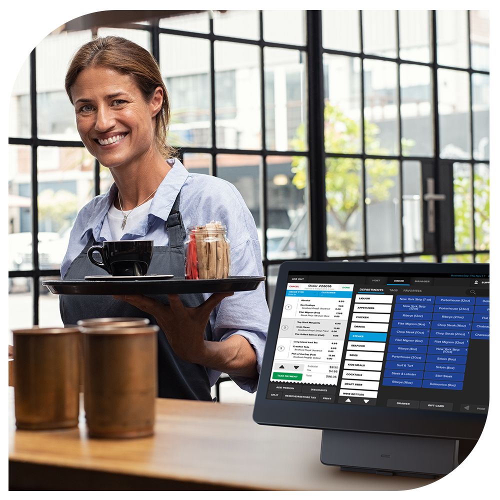 Coffee shop POS system barista standing next to SkyTab POS workstation