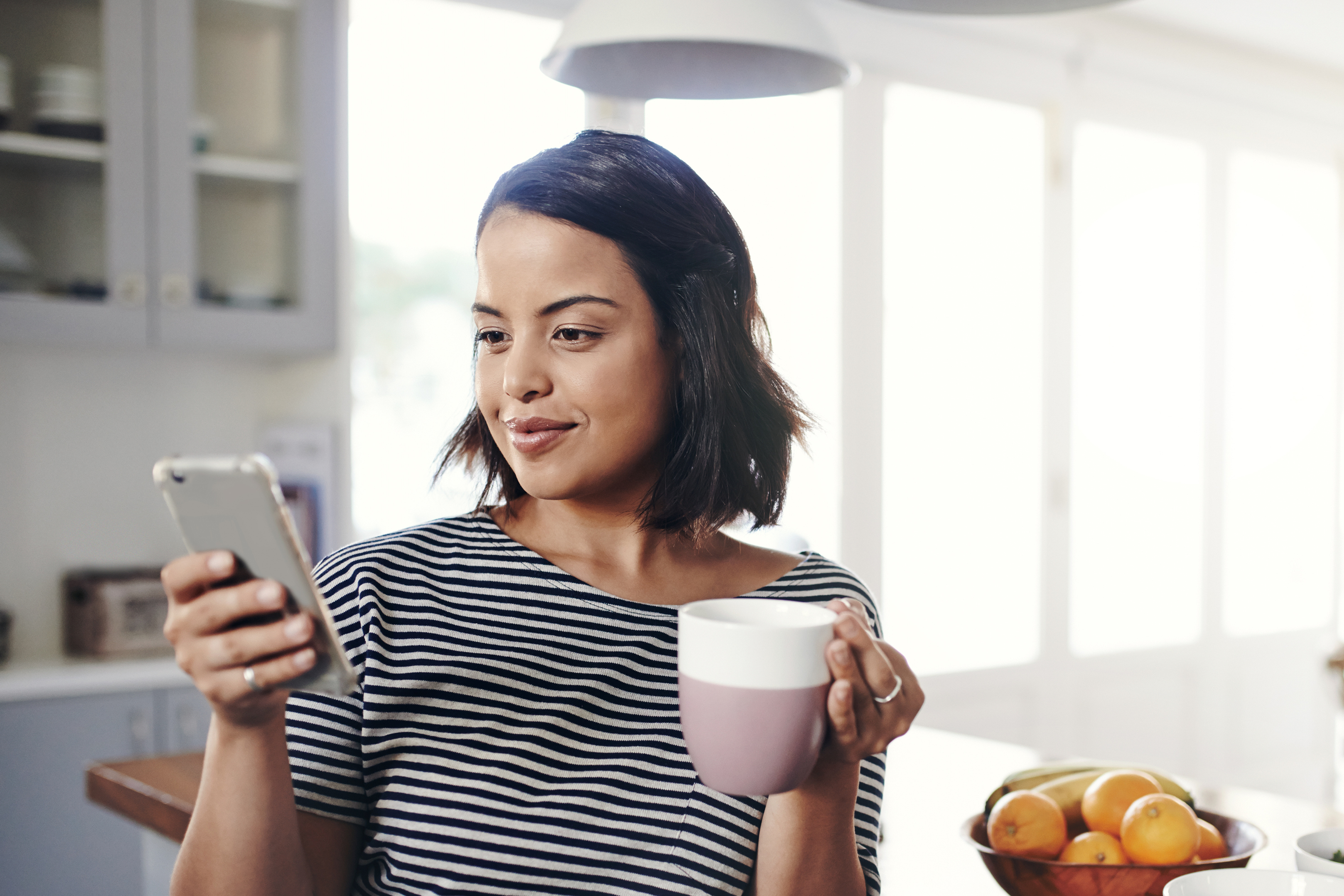 Restaurant labor management person checking their phone for employee schedules
