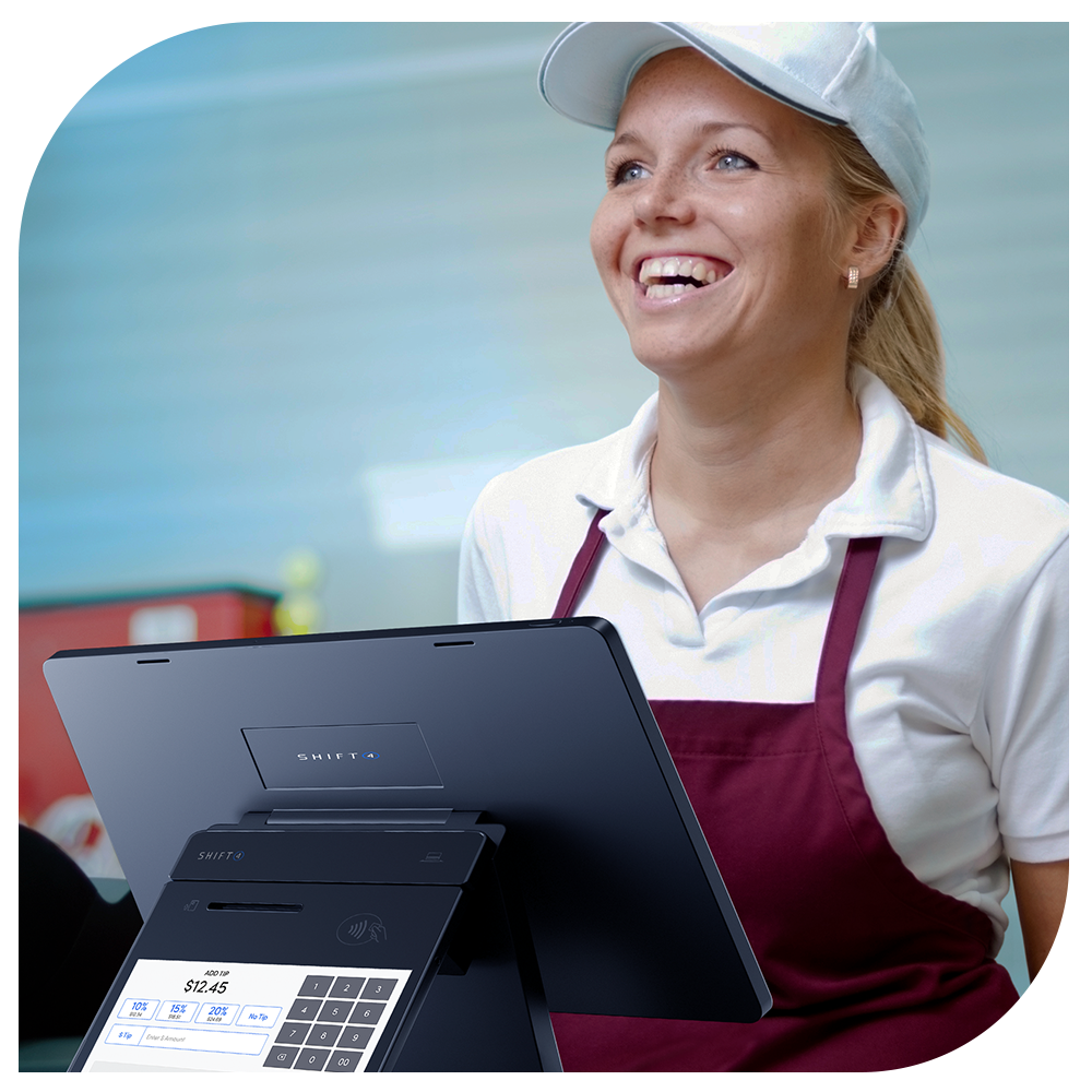 Quick Service POS QSR POS restaurant smiling employee taking an order with SkyTab workstation