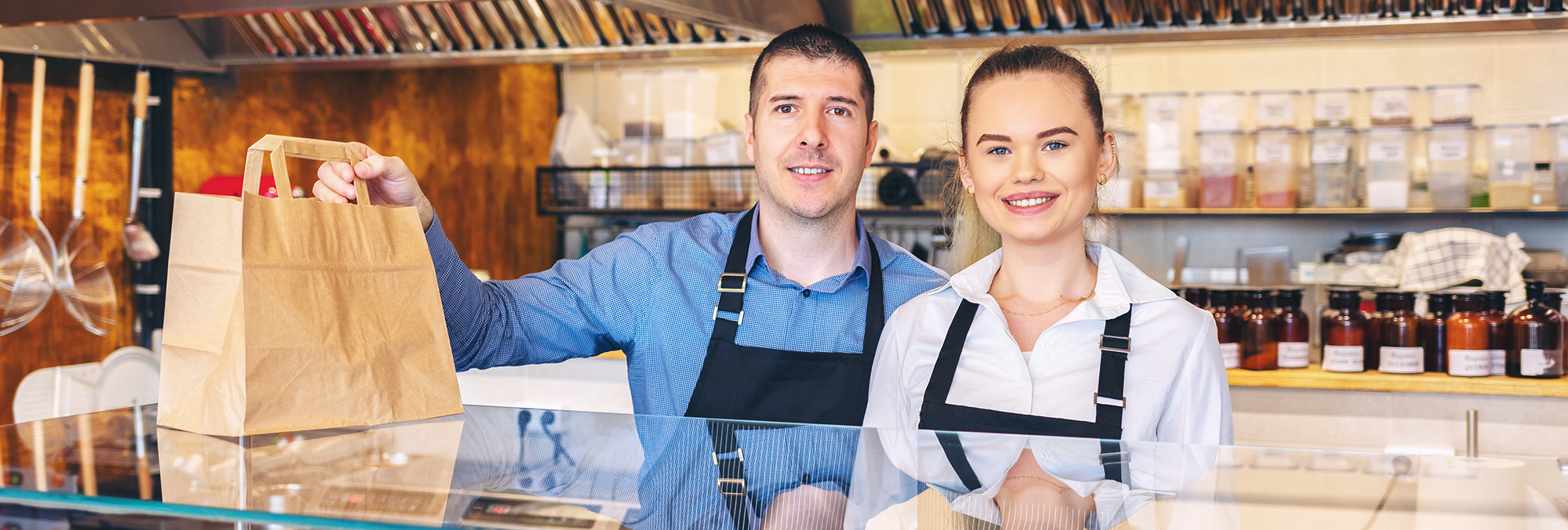 Quick-service POS food truck owners smiling
