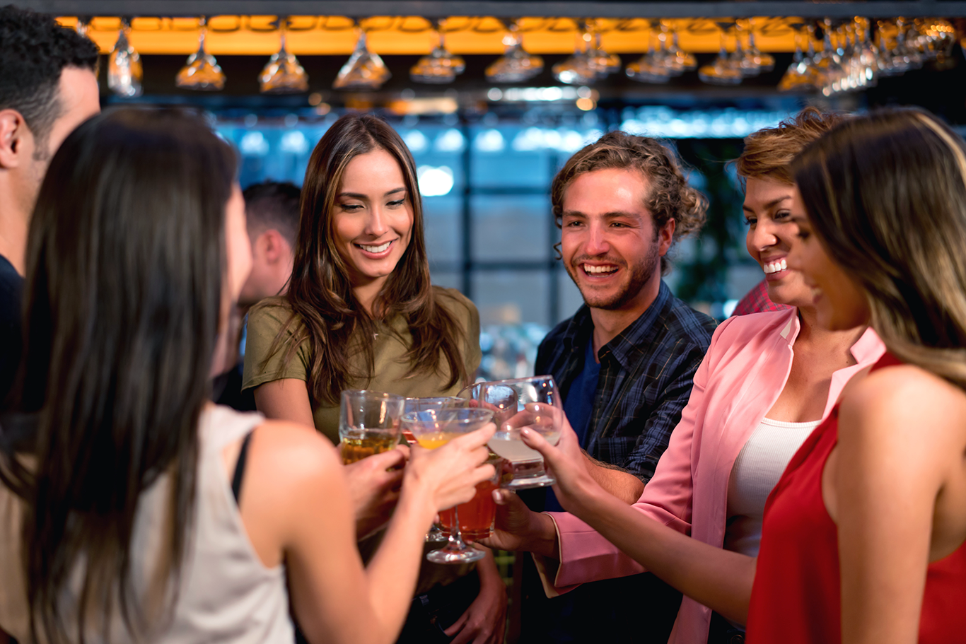 Restaurant POS system bar and nightclub customers raising a toast