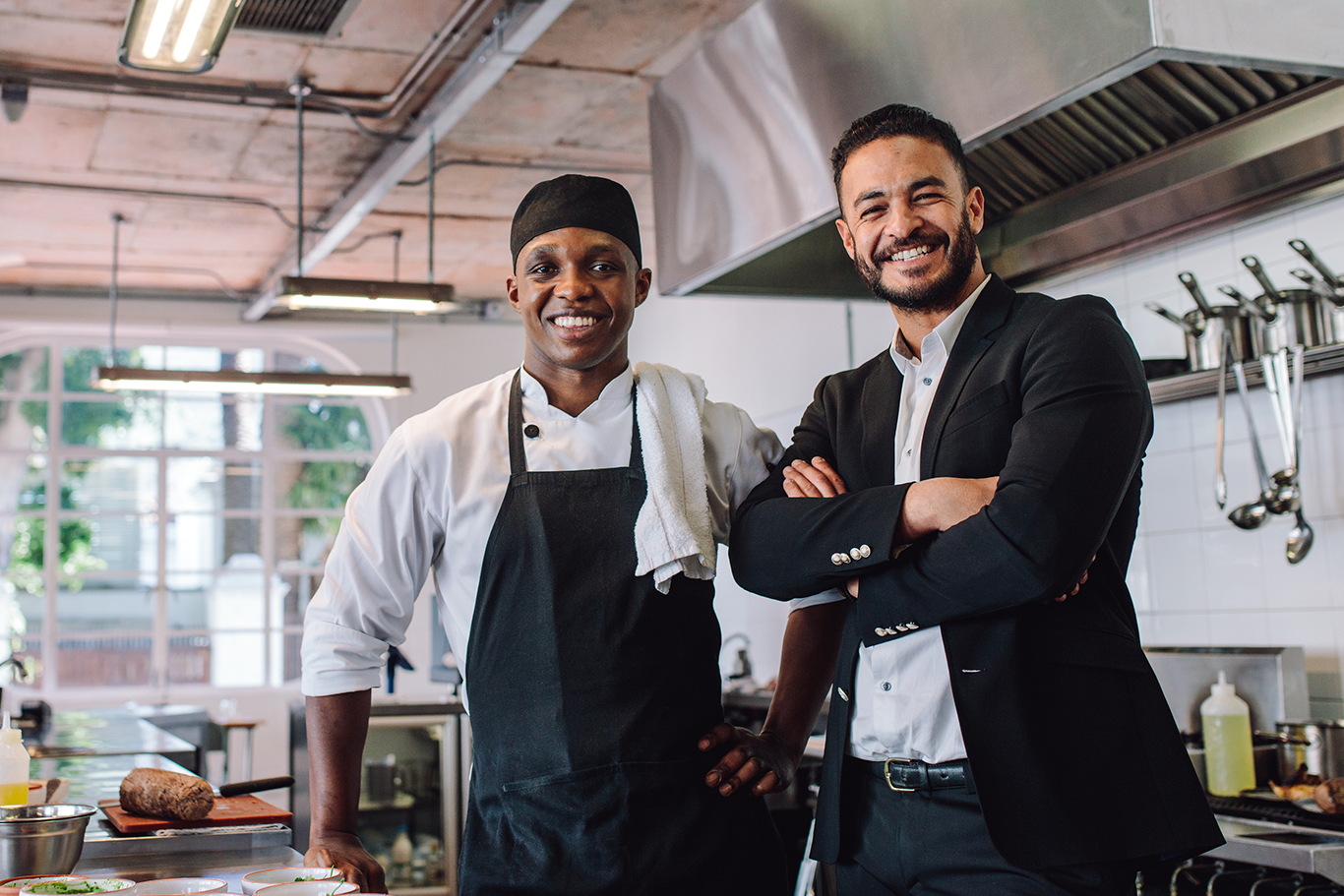 Restaurant POS system enterprise owner and chef smiling