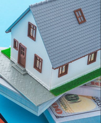 House with money under it.