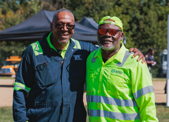 Image of two City of Baltimore employees standing side by side