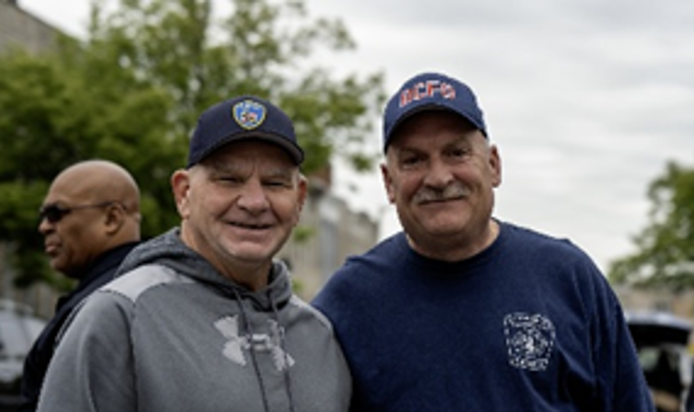 Image of two City of Baltimore employees smiling.