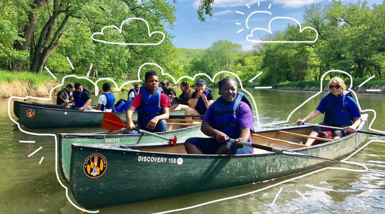 Children and adults in canoes