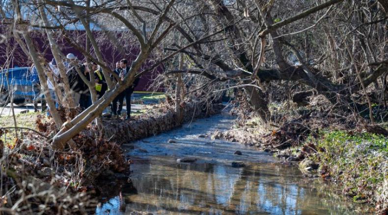 Inspectors inspecting the damage of a river after a recent storm.