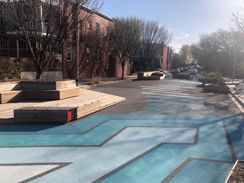 A road that has been painted in blue designs