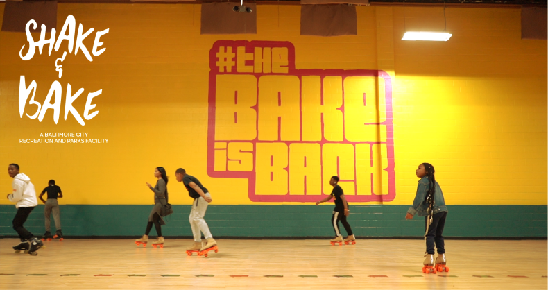 People roller skating in an indoor rink