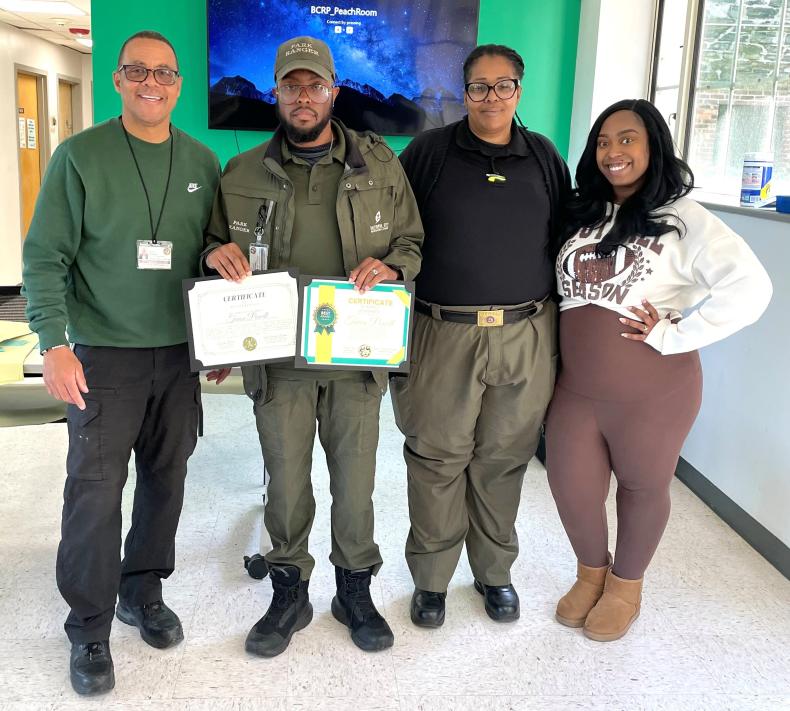 Recreation and Parks The chief of Risk and Safety along with 2 of his rangers smiling for a picture 