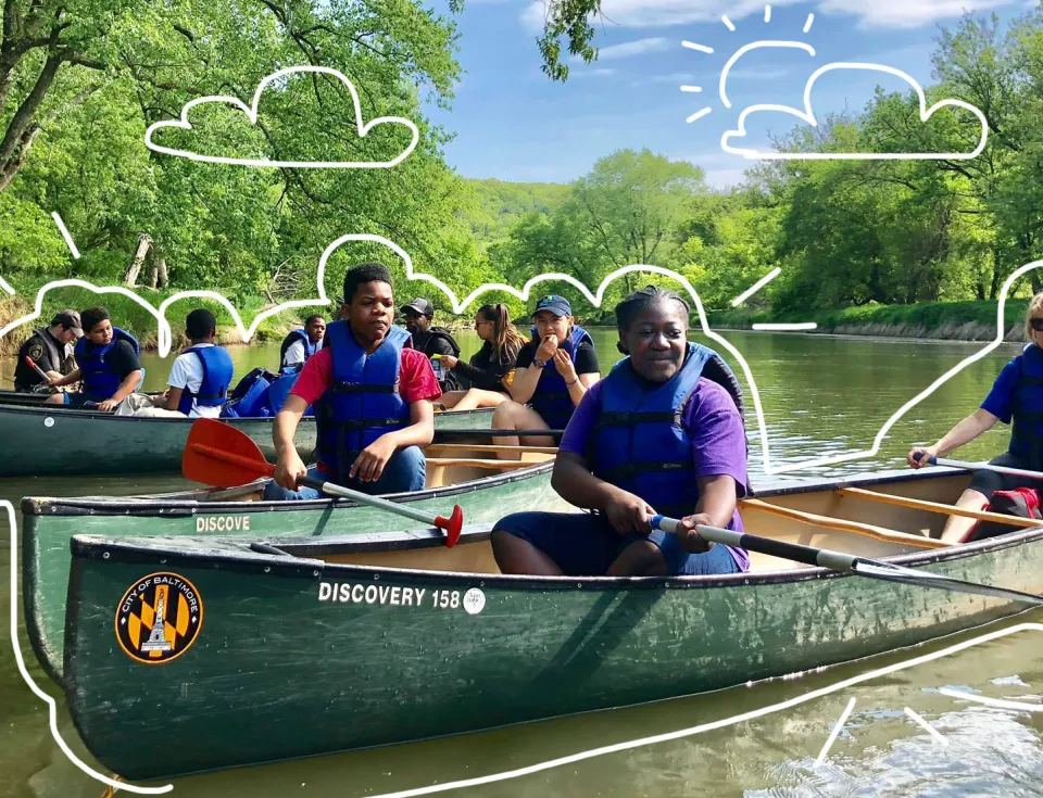 Children and adults in canoes