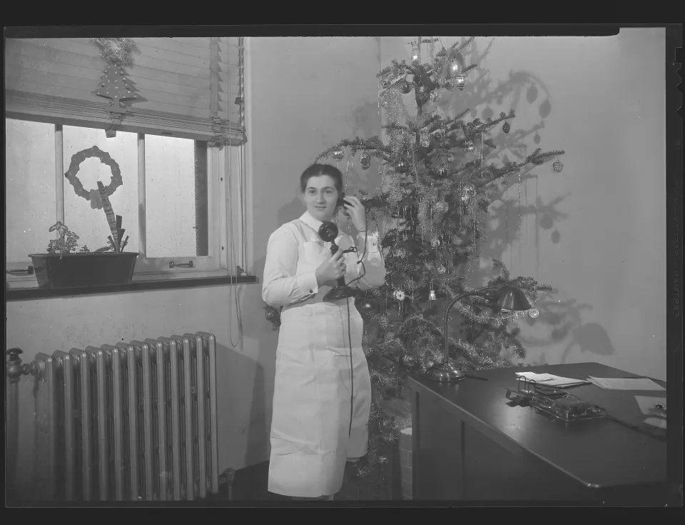 This photo of an unidentified nurse with her office decorated for Christmas was taken at Baltimore City Hospital in about 1936.