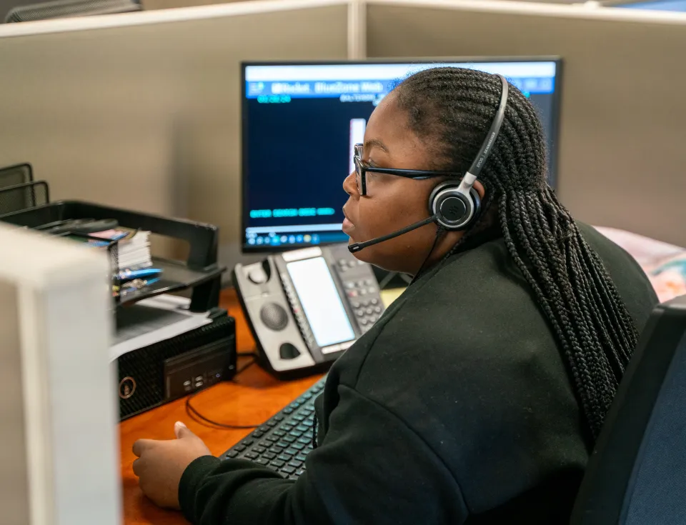 A 311 customer service representative handling inquires 