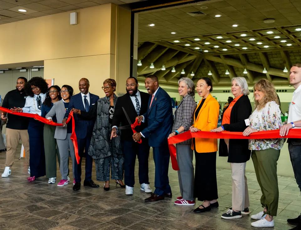 directors, partners, and sponsors at ribbon cutting for 2026 small business advancement conference