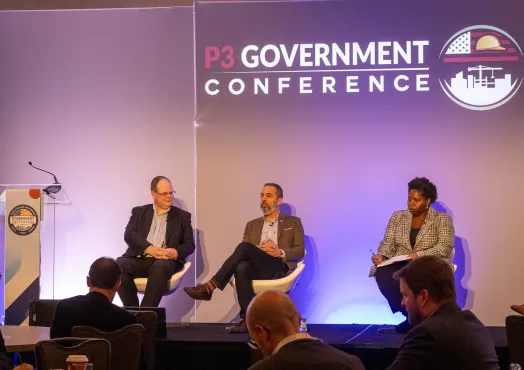 Panelists sit on stage against backdrop that reads P3 Government Conference