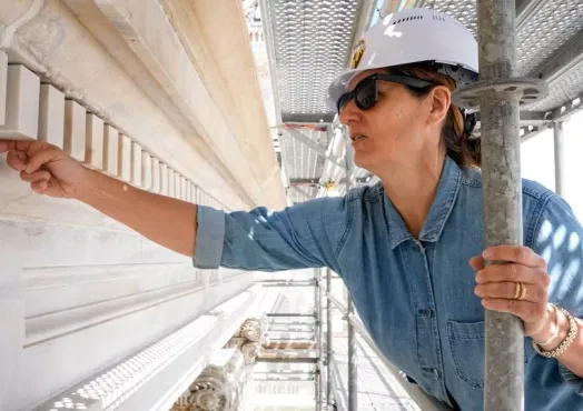 Historic Conservator inspects stone on City Hall facade