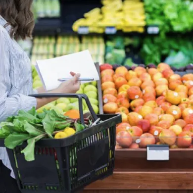 Woman at store browsing apples