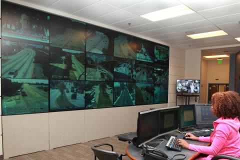 Woman with curly hair in a control room