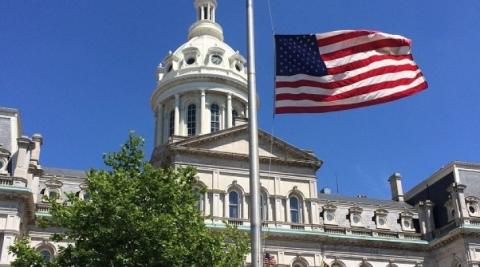 A flag flying in front of a building