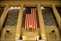 A huge U.S. flag hanging on the front of the Memorial Hall