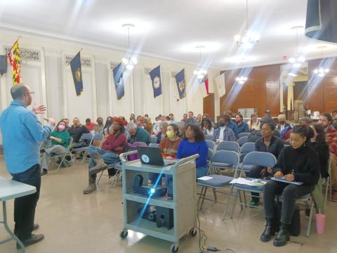 Speaker talking in front of an audience