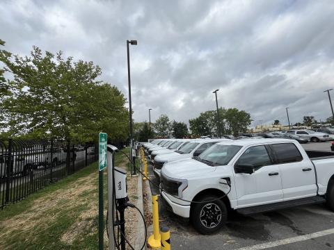 EV pick-up trucks at a charging station