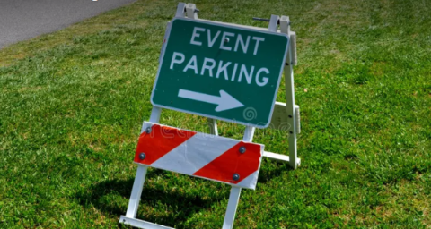 event parking sign on grass
