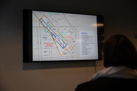 person looking at street map on a video screen