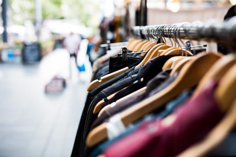 Clothing on hangars on a city street