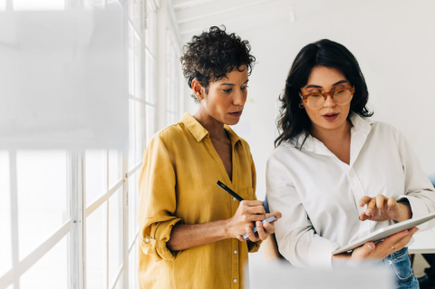 two women looking at a plan 