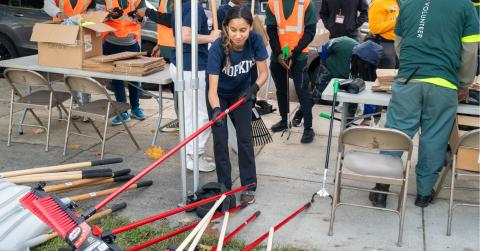 woman volunteering at community clean up 