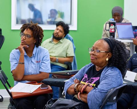 People listening to someone speak