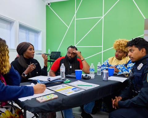 People at table having discussion