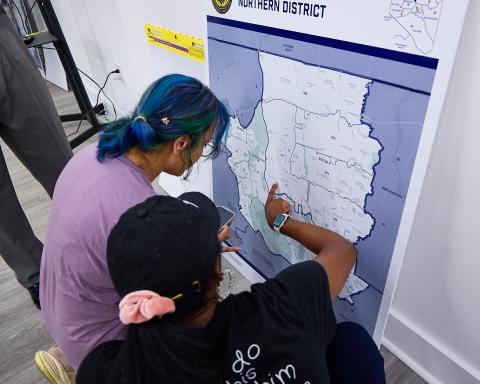 People examining map of BPD Northern District