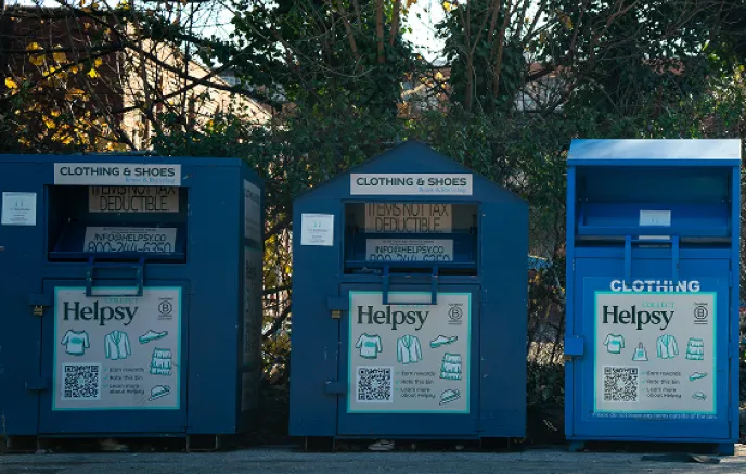 These are Helpsy donation bins for collecting clothing and shoes