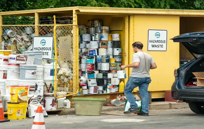 Man unloading hazardous waste