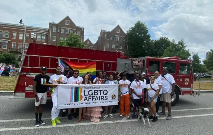 LGBTQ supporters holding banner